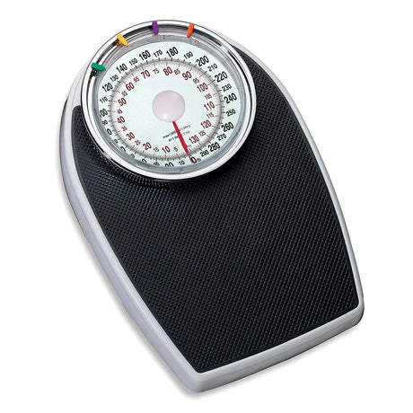 Black analog bathroom scale with a traditional dial display, featuring bold numbers and colored markers for easy weight tracking. The scale has a sturdy base and a non-slip textured surface.